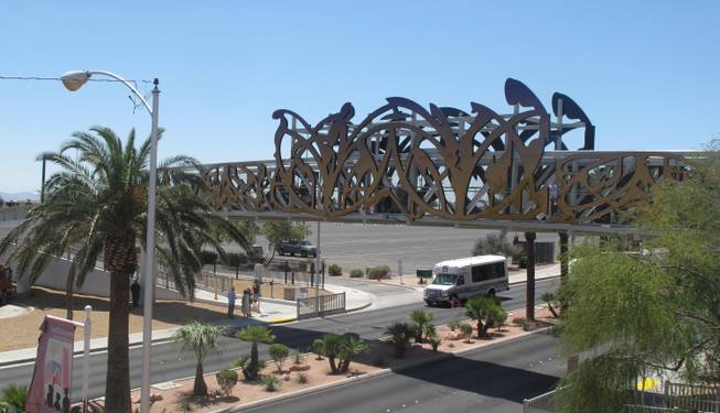 The $1.3 million pedestrian bridge stretches over Las Vegas Boulevard between East Washington Avenue and East Bonanza Road. It is decorated with an LED design created by artist David Griggs inspired by the iconic neon signs of the city's past.