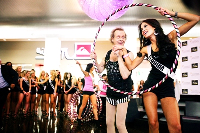 Richard Simmons and hula hoop contest winner Miss Florida Lissette Garcia pose for photos after the contest at the Miracle Mile Shops at Planet Hollywood Friday, June 10, 2011.