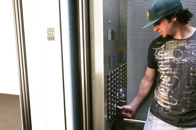Anthony Young goes up to his apartment at Veer Towers in CityCenter Wednesday, June 15, 2011.