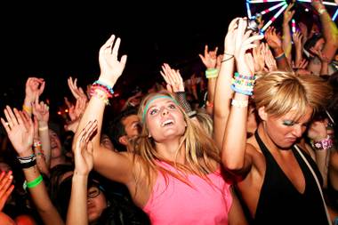 Attendees dance to the beat at Kinetic Field during the Electric Daisy Carnival at Las Vegas Motor Speedway on Sunday, June 26,&nbsp;2011.