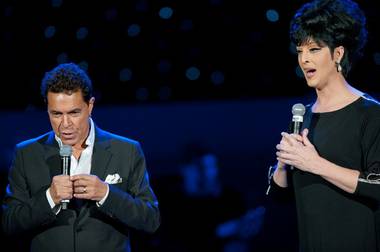 Clint Holmes, left, with Zumanity‘s Edie the Entertainer at Golden Rainbow’s Ribbon of Life HIV/AIDS fundraiser at the Paris on June 26, 2011.