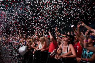 Confetti falls on the audience as Swedish House Mafia  begins their set at the Electric Daisy Carnival at the Las Vegas Motor Speedway Sunday June 26, 2011.