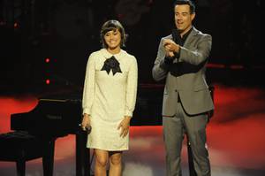 Dia Frampton appears on the NBC talent show <em>The Voice</em> with host Carson Daly.