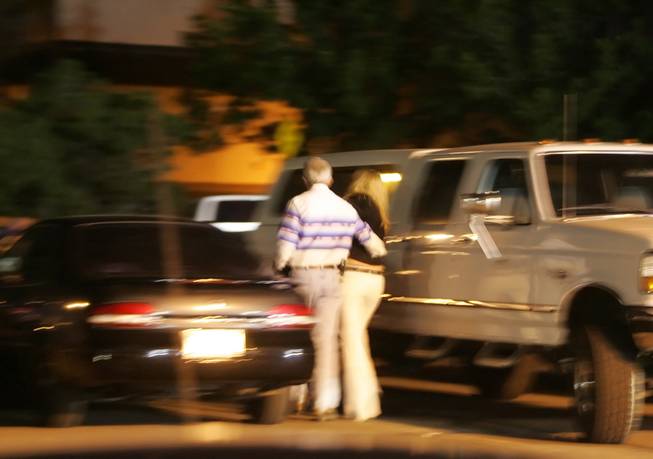 Photo by Brad Horn/Nevada Appeal
Nevada Gov. Jim Gibbons escorts Leslie Durant to the parking lot of the Reno Rodeo in June 2008. Gibbons now faces adultery  allegations from his estranged wife