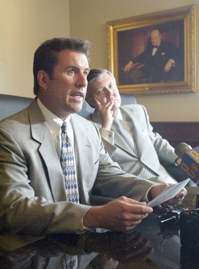 Former County Commissioner Lance Malone reads a statement with his lawyer Don Campbell in Campbell's office Friday, May 23, 2003. Malone is the target of a federal investigation into political corruption.  SAM MORRIS / LAS VEGAS SUN