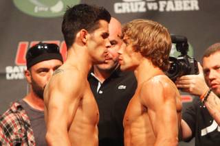 Dominick Cruz (left) faces off with Urijah Faber during the weigh in for UFC 132 Friday, July 1, 2011 at the MGM Grand Garden Arena.