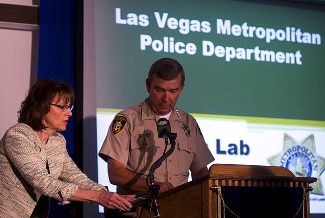 Linda Krueger, left, executive director of the Metro Police Criminalistics Bureau, speaks to Sheriff Doug Gillespie before a news conference at Metro offices July 7, 2011. 