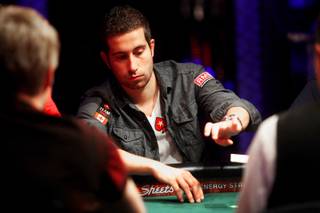 Last years winner, Jonathan Duhamel, folds his hand during Day 1C of the World Series of Poker main event at the Rio Las Vegas Saturday, July 9, 2011. To accommodate all the entries, there are four 