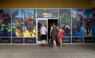 A family enters the Maximum Comics store in Henderson Sunday, July 10, 2011.