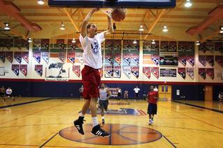 Coronado high school senior basketball player Michael Louder dunks during practice Wednesday, July 13, 2011.