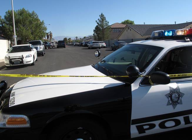Metro Police investigate after officers fatally shot 23-year-old Rafael Alonso Olivas on July 14, 2011, in the western Las Vegas Valley. 
