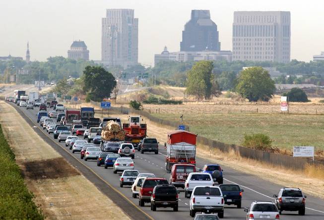 Motorists head south on Interstate 5 toward downtown Sacramento, Calif., during the morning rush hour Friday, July 12, 2002.