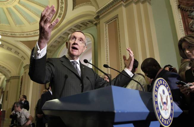 Senate Majority Leader Harry Reid speaks to reporters following the Democrats' weekly policy meeting on Capitol Hill in Washington, Tuesday, July 19, 2011.