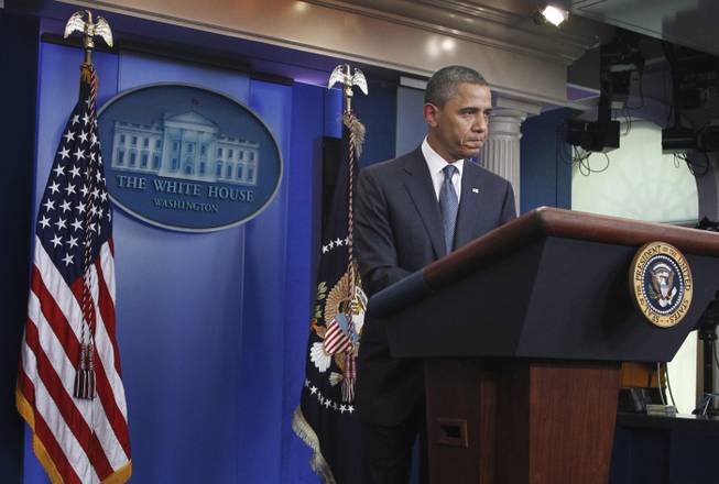 President Barack Obama discusses the continuing budget talks, Tuesday, July 19, 2011, in the the briefing room of the White House in Washington. 