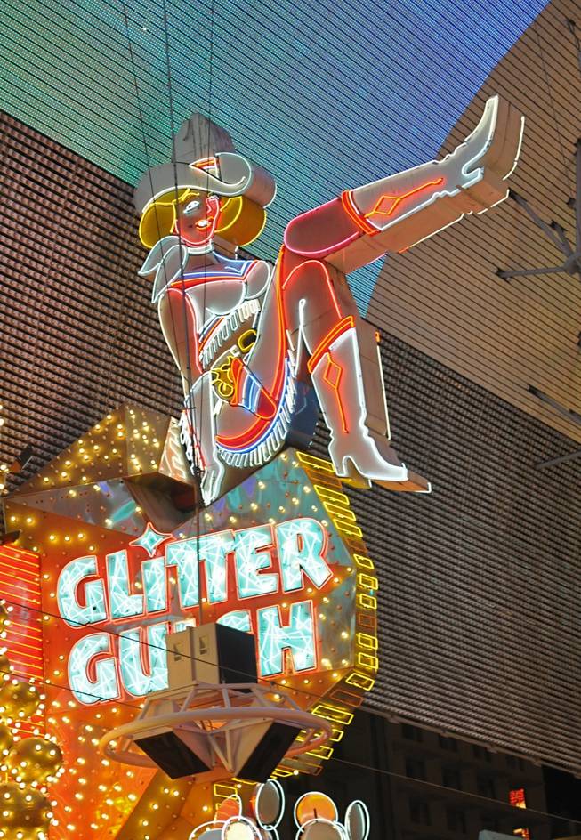Neon cowboy landmark, Vegas Vicky, sits atop of the Glitter Gulch on Fremont Street. 