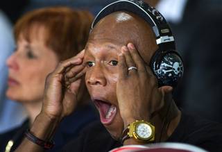 IBF junior welterweight champion Zab Judah of New York yawns during a news conference at the Mandalay Bay Events Center Thursday July 21, 2011. Main Events CEO Kathy Duva is in the background. Judah will defend his title against WBA super lightweight champion Amir Khan at the arena Saturday.