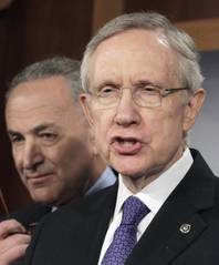 Senate Majority leader Harry Reid of Nev., right, accompanied by Sen. Charles Schumer, D-NY, speaks to reporters on Capitol Hill in Washington, Monday, July 25, 2011, as they announce a new proposal to solve the debt limit crisis.