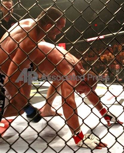 Dan Henderson winds up to throw a punch at Fedor Emelianenko in their Strikeforce heavyweight bout. The uppercut he eventually threw ended the fight with a TKO win for Henderson. 