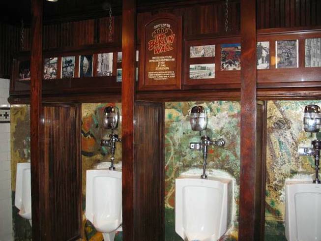The urinals in the men's room at Main Street Station are set into a portion of the Berlin Wall.