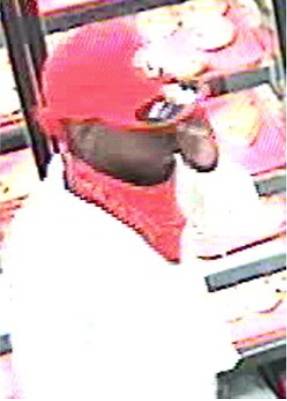 A photo caught by security cameras on July 2, of a man suspected in a business robbery. 