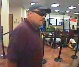 Surveillance photos of a suspect who robbed a bank on East Charleston on Friday, August 5.