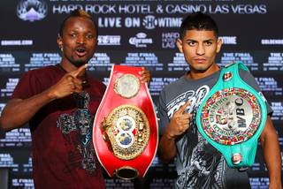 IBF bantamweight champion Joseph Agbeko, left, of Ghana and Abner Mares of Mexico pose during a news conference at the Hard Rock Hotel on Thursday, Aug. 11, 2011. Agbeko will defend his title against Mares at the resort Saturday.