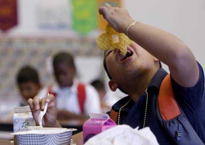 A student eats breakfast at Cortez Elementary School on July 8, 2009.