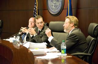 Nevada Gaming Commissioner John Moran Jr. asks attorney Patty Becker and Michael Eide, representing Dotty's Gaming & Spirits, a series of questions regarding the establishment, Thursday, Aug. 25, 2011. The commission heard arguments by Dotty's regarding a change to state gaming regulations.