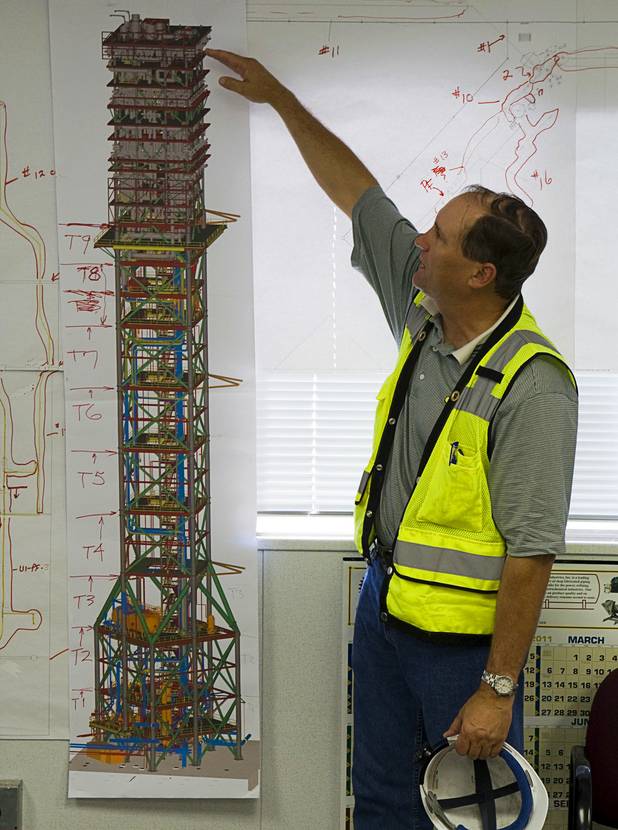Mike Bobinecz, BrightSource project director at the Ivanpah Solar Electric Generating System construction site, gestures to a diagram of the Ivanpah 1 tower under construction just south of Primm in California Monday, August 29, 2011. The tower is currently at the "T3" level.