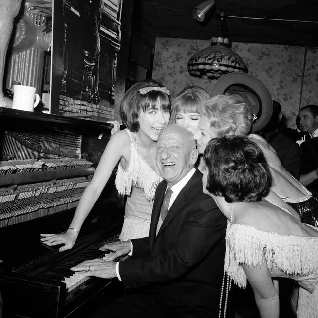 Jimmy Durante is greeted by performers at the Gaslight Club where he celebrates his 50 years in show business in New York City, Sept. 30, 1963.