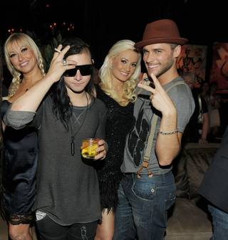 Holly Madison, second from right and with Tanya Popovich, DJ Skrillex and Josh Strickland, hosts Blush's fourth-anniversary celebration at the Wynn on Sept. 4, 2011.