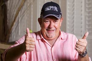 Robin Leach poses with a Keep Memory Alive cap at his home Wednesday, Sept. 7, 2011. Keep Memory Alive raises money for research to develop a cure for Alzheimer's Disease.