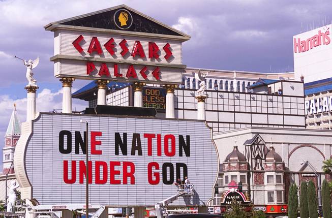 Jeremy Jackson and Roy Coronado put a message of solidarity on the Caesars Palace marquee Wednesday, Sept. 12, 2001, on the Las Vegas Strip in response to the terrorist attacks in New York and Washington, D.C.