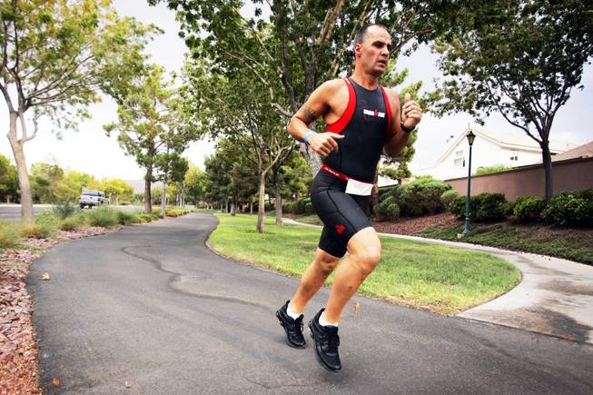 Ironman athlete John Michael Muntean trains in Henderson on Thursday, Sept. 8, 2011. Muntean will be competing in the Ironman world championship in Henderson on Sunday.