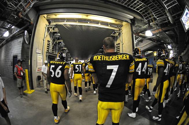 Pittsburgh quarterback Ben Roethlisberger makes his way out to the field before a preseason game.