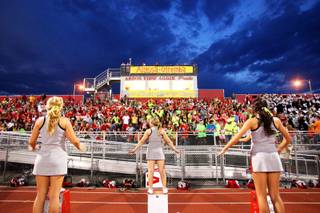Banners are on display and Arbor View fans wear fluorescent colors during a game against Centennial on Friday, Sept. 9, 2011, in honor of 15-year-old Alyssa Otremba, an Arbor View sophomore and band member, found slain last week.