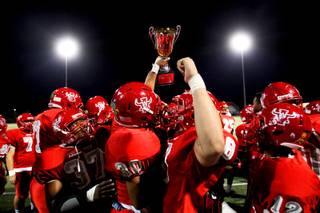 Arbor View holds up the rivalry trophy after its 20-13 win over Centennial on Friday, Sept. 9, 2011.