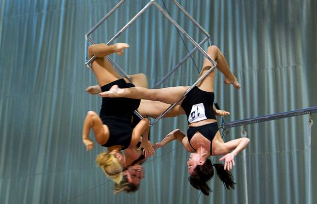 Laura Sheely, right, performs with Nikki Blakeslee, left,  and Rebecca Freund, background, during auditions for new Cirque du Soleil performers in the "O" Theater at the Bellagio Monday September 12, 2011.