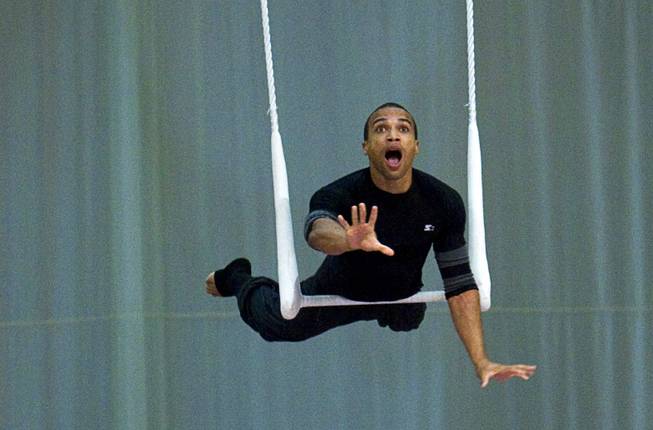Marshall Amey, 29, of Boulder, Colorado performs on the single trapeze during auditions for new Cirque du Soleil performers in the "O" Theater at the Bellagio Monday September 12, 2011.  .