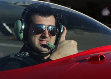 Hypnotist Marc Savard in the seat of his Extra 330LC at Sky Combat Ace.