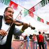 Violin player Sandor Beke entertains the crowds near the food booths during the San Gennaro Feast at the Rio on Wednesday, Sept. 14, 2011.