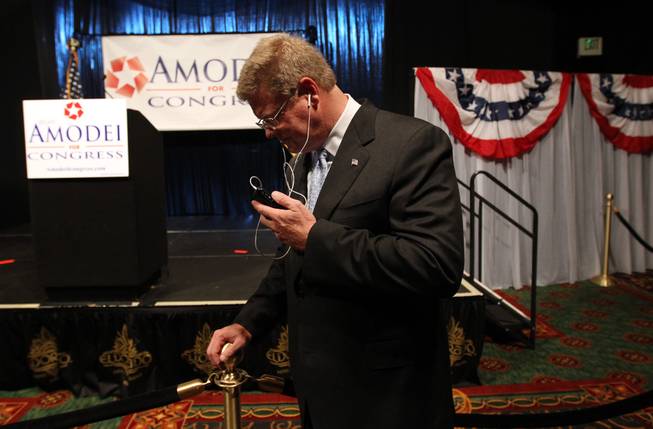 Former Republican state senator Mark Amodei takes a phone call from the National Republican Committee chairman after taking the lead in Nevada's special election to fill a U.S. House seat, during an election night event in Reno on Tuesday Sept. 13, 2011. 