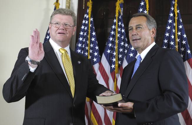 House Speaker John Boehner of Ohio, right, administers the House Oath to Rep. Mark Amodei, R-Nev., on Capitol Hill in Washington, Thursday, Sept. 15, 2011, during a ceremonial swearing-in ceremony, following his official swearing in on the floor of the House.