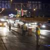 A sealing crew inspects a section of roadway during resurfacing of Interstate 15 between Tropicana Avenue and Charleston Boulevard on Monday, Sept. 19, 2011.