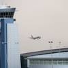 A US Airways jet is seen during a rainstorm at McCarran International Airport on Monday, Oct. 3, 2011. 