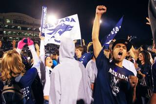 UNR fans celebrate after a game against UNLV on aturday, Oct. 8, 2011, at Mackay Stadium in Reno. UNR won the game 37-0 to extend its winning streak over UNLV to seven.