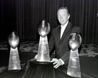 Raiders owner Al Davis with the Super Bowl trophy. Davis, who won three Super Bowl titles during his half century in professional football, died Saturday at his home in Oakland at age 82. The cause of death was not immediately disclosed.
