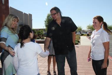 After advancing to another round on “Celebrity Apprentice,” Penn Jillette visits Opportunity Village to deliver a check worth $40,000 earned from his wins on the show.