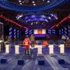 Mark Mondi takes a photo of his son John, 14, on the CNN debate stage in the Sands Expo Center on Monday, Oct. 17, 2011. CNN will host Republican presidential candidates in a televised debate at the Sands Expo today.