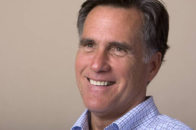 Former Massachusetts Gov. Mitt Romney smiles during an interview in Las Vegas Monday, Oct. 17, 2011.
